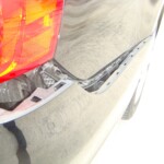 Before and after photographs of a damaged black Volkswagon Jetta that was repaired by Elite Paint & Body Shop in West Palm Beach, Florida.